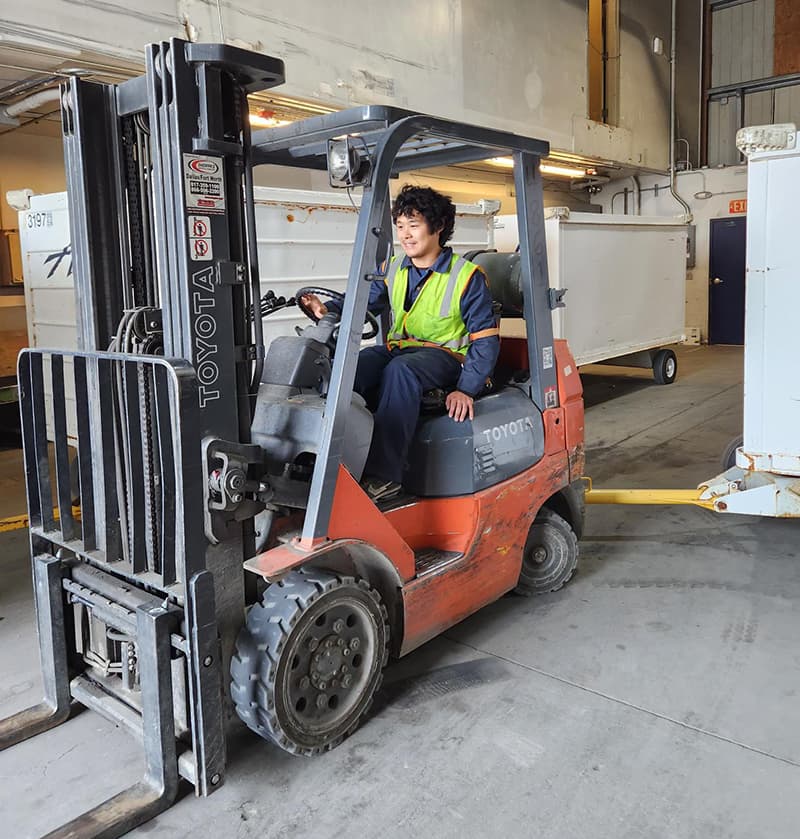 Man driving cargo forklift