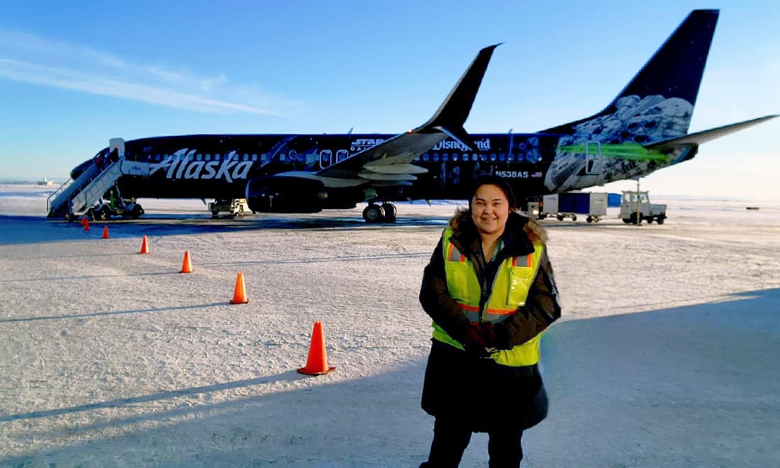 Alaska Air Cargo plane and employee in yellow vest, Bethel, Alaska